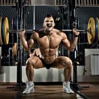 bodybuilder squating with olympic weights