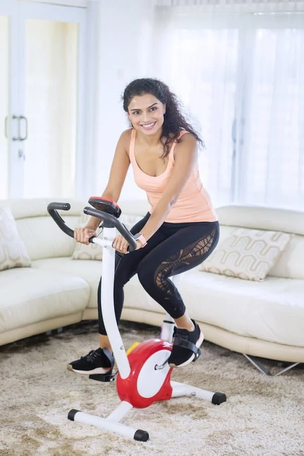 Women Riding Best Folding Exercise Bike